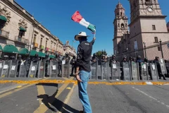 Người dân Mexico biểu tình yêu cầu làm rõ vụ việc và đảm bảo an ninh khu vực. (Nguồn: AFP/Getty Images)