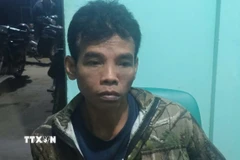 Đối tượng Điểu Trung bị bắt. (Ảnh: TTXVN phát)
