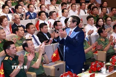 Thủ tướng Phạm Minh Chính dự Đại hội Thi đua “Vì an ninh Tổ quốc” lần thứ 9. (Ảnh: Dương Giang/TTXVN)