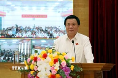 Ông Nguyễn Xuân Thắng, Ủy viên Bộ Chính trị, Giám đốc Học viện Chính trị quốc gia Hồ Chí Minh, Chủ tịch Hội đồng Lý luận Trung ương phát biểu tại buổi tiếp xúc cử tri. (Ảnh: Đức Hiếu/TTXVN)