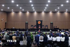 Các bị cáo tại phiên tòa xét xử chiều 14/1. (Ảnh: Phạm Kiên/TTXVN)