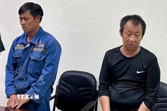 Các đối tượng tại Cơ quan Công an. (Ảnh: TTXVN phát)