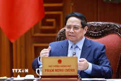 Thủ tướng Phạm Minh Chính chủ trì cuộc họp về triển khai đẩy nhanh tiến độ thực hiện các dự án đường sắt kết nối Việt-Trung. (Ảnh: Dương Giang/TTXVN)