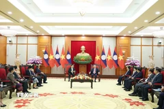 Tổng Bí thư Tô Lâm gặp Tổng Bí thư, Chủ tịch nước Lào Thongloun Sisoulith. (Ảnh: Thống Nhất/TTXVN)