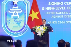 Thủ tướng Phạm Minh Chính phát biểu tại cuộc gặp gỡ báo chí Lễ mở ký và Hội nghị cấp cao Công ước của Liên hợp quốc về chống tội phạm mạng. (Ảnh: Dương Giang/TTXVN)