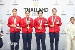 Các vận động viên Nguyễn Thị Phương, Nguyễn Ngọc Trâm, Bùi Ngọc Nhi và Hoàng Thị Thu Uyên xuất sắc giành huy chương Vàng nội dung Kata đồng đội nữ. (Ảnh: TTXVN phát)