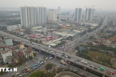 Tăng tính minh bạch thông qua việc mở rộng áp dụng bảng giá đất. (Ảnh: TTXVN phát)