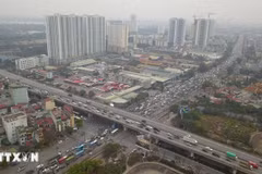 Tăng tính minh bạch thông qua việc mở rộng áp dụng bảng giá đất. (Ảnh: TTXVN phát)