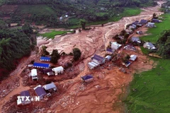 Bản Đứa Cát, xã Chiềng Sơ tan hoang sau trận lũ ống, lũ quét vào đêm 26, rạng sáng 27/7. (Ảnh: Quang Quyết/TTXVN)