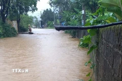 Mưa lớn tại xã Bản Giang, huyện Tam Đường, có 70 ngôi nhà bị ngập. (Ảnh: TTXVN phát)