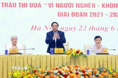 Thủ tướng Phạm Minh Chính chủ trì Hội nghị toàn quốc tổng kết Chương trình mục tiêu quốc gia xây dựng nông thôn mới. (Ảnh: Dương Giang/TTXVN)
