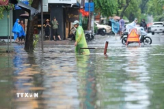 Nước ngập sâu trên phố Trần Quốc Toản ngày 7/10. (Ảnh: Hoàng Hiếu/TTXVN)