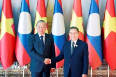 Tổng Bí thư Tô Lâm hội kiến Chủ tịch Quốc hội Lào Saysomphone Phomvihane. (Ảnh: Thống Nhất/TTXVN)