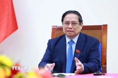 Thủ tướng Phạm Minh Chính điện đàm với Thủ tướng Singapore Lawrence Wong. (Ảnh: Dương Giang/TTXVN)