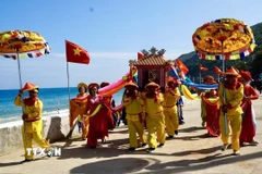 Một trong các nghi thức của Lễ hội. (Ảnh: Sỹ Thắng/TTXVN)