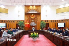 Thủ tướng Phạm Minh Chính chủ trì họp về công tác khắc phục hư hỏng công trình cầu sông Lô thuộc địa bàn xã Đoan Hùng, tỉnh Phú Thọ. (Ảnh: Dương Giang/TTXVN)