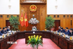 Thủ tướng Phạm Minh Chính chủ trì họp về công tác khắc phục hư hỏng công trình cầu sông Lô thuộc địa bàn xã Đoan Hùng, tỉnh Phú Thọ. (Ảnh: Dương Giang/TTXVN)