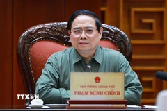 Thủ tướng Phạm Minh Chính chủ trì họp về công tác khắc phục hư hỏng công trình cầu sông Lô thuộc địa bàn xã Đoan Hùng, tỉnh Phú Thọ. (Ảnh: Dương Giang/TTXVN)
