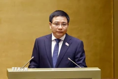Bộ trưởng Bộ Tài chính Nguyễn Văn Thắng, thừa ủy quyền của Thủ tướng Chính phủ trình bày Tờ trình dự án Luật sửa đổi, bổ sung một số điều của Luật Đấu thầu; Luật Đầu tư theo phương thức đối tác công tư; Luật Hải quan; Luật Thuế xuất khẩu, thuế nhập khẩu; Luật Đầu tư; Luật Đầu tư công; Luật Quản lý, sử dụng tài sản công. (Ảnh: Doãn Tấn/TTXVN)