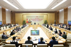 Hội nghị tổng kết “Chiến dịch Quang Trung” xây dựng lại nhà cho các gia đình bị thiệt hại do bão lũ tại miền Trung. (Ảnh: Dương Giang/TTXVN)