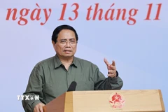 Thủ tướng Phạm Minh Chính chủ trì hội nghị khắc phục hậu quả thiên tai khu vực miền Trung. (Ảnh: Dương Giang/TTXVN)