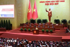 Phiên thảo luận tại hội trường về các văn kiện Đại hội. (Ảnh: TTXVN)