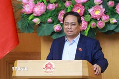 Thủ tướng Phạm Minh Chính chủ trì họp đánh giá tác động của các cuộc xung đột trên thế giới ảnh hưởng đến tình hình kinh tế-xã hội trong nước. (Ảnh: Dương Giang/TTXVN)