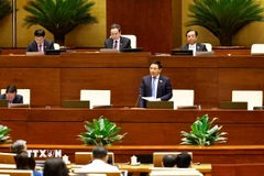 Bộ trưởng Bộ Tài chính Nguyễn Văn Thắng phát biểu giải trình, làm rõ một số vấn đề đại biểu Quốc hội nêu. (Ảnh: Doãn Tấn/TTXVN)
