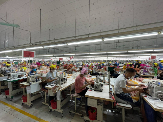 Một số nhà máy tại Bắc Giang đã hoạt động trở lại. (Ảnh: PV/Vietnam+) Bắc Giang tấn công vào 3 mặt trận lớn để dẹp ‘cơn ác mộng’ COVID-19 ảnh 4