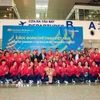 Đoàn thể thao Việt Nam tại sân bay quốc tế Nội Bài, sáng 7/12. (Ảnh: TTXVN phát)