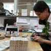 Ngân hàng Nhà nước lý giải nguyên nhân tỷ giá tăng khi USD thế giới giảm. (Ảnh: Vietnam+)