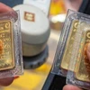 Giá vàng SJC của Công ty vàng bạc đá quý Sài Gòn và Công ty Doji niêm yết từ 152,2-154,2 triệu đồng/lượng. (Ảnh: VIetnam+)
