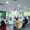 Vietcombank giảm 2% lãi suất cho vay hỗ trợ khách hàng bị thiệt hại bão, lũ. (Ảnh: Vietnam+)