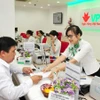 VPBank dành 20.000 tỷ đồng hỗ trợ hộ kinh doanh thích ứng với quản lý thuế mới. (Ảnh: Vietnam+)