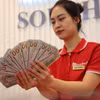 Giá vàng tăng 500.000 đồng, tỷ giá giảm tới 60 đồng phiên chiều nay. (Ảnh: Vietnam+)