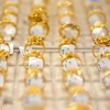 Giá vàng trong nước biến động không đồng nhất, tỷ giá đi ngang. (Ảnh: Vietnam+)