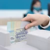 Ngân hàng đặt mục tiêu tăng trưởng tín dụng 16% để hỗ trợ tăng trưởng kinh tế. (Ảnh: Vietnam+)