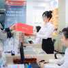 Giao dịch chuyển tiền từ 400 triệu đồng có thể phải chờ 24 giờ. (Ảnh: Vietnam+)