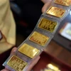 Vàng lao dốc gần 20 triệu đồng/lượng sau cơn sốt kỷ lục. (Ảnh: Vietnam+)