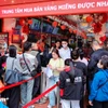 Nhiều người dân xếp hàng từ sáng sớm mua vàng ngày Vía Thần Tài. (Ảnh: Vietnam+)