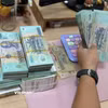 Ngân hàng đồng loạt giảm lãi suất huy động và cho vay, tiếp sức nền kinh tế. (Ảnh: Vietnam+)