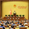 Chủ nhiệm Ủy ban Pháp luật và Tư pháp của Quốc hội Phan Chí Hiếu trình bày Báo cáo thẩm tra về dự án Luật Thủ đô (sửa đổi). (Ảnh: Dương Giang/TTXVN)