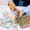 Nhiều ngân hàng đồng loạt giảm mạnh lãi suất huy động sau cuộc họp với Ngân hàng Nhà nước. (Ảnh: Vietnam+)