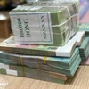 Ngân hàng dồn dập chia cổ phiếu “khủng” để tăng vốn điều lệ. (Ảnh: Vietnam+)