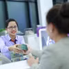 Ngân hàng tăng cường chi trả cổ tức cho cổ đông hiện hữu. (Ảnh: Vietnam+)
