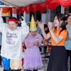 Niềm vui sướng hồn nhiên và rạng rỡ của các em đã thắp sáng cả một ngày đặc biệt. (Ảnh: Vietnam+)