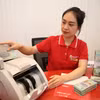 Ngân hàng Nhà nước chỉ đạo giảm lãi, tiếp vốn cho doanh nghiệp nhỏ và vừa. (Ảnh: Vietnam+)