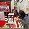 Giá vàng trong nước đi ngang, tỷ giá trung tâm tăng thêm 3 đồng. (Ảnh: Vietnam+)