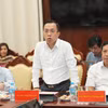 Ông Lê Hoàng Chính Quang - Cục trưởng Cục Công nghệ thông tin Ngân hàng Nhà nước chia sẻ tại họp báo. (Ảnh: Vietnam+)