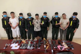 Các đối tượng và tang vật bị lực lượng Công an Cao Bằng bắt giữ. (Nguồn: Công an nhân dân)